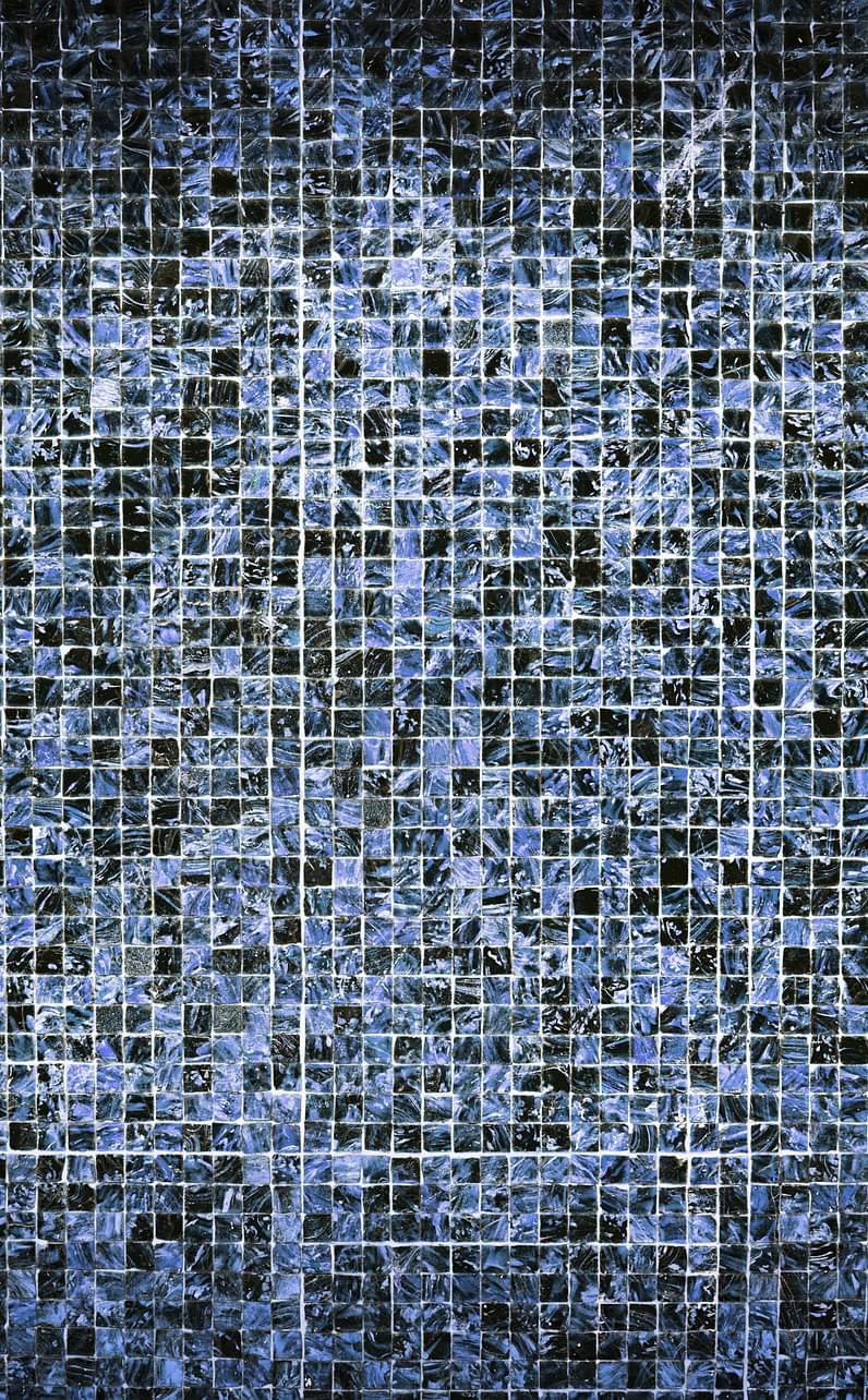 Hundred of small tiles of various shades of blue.